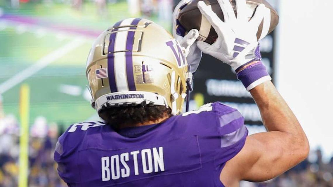  Oct 5, 2024; Seattle, Washington, USA; Washington Huskies wide receiver Denzel Boston (12) catches a touchdown pass against the Michigan Wolverines during the first quarter at Alaska Airlines Field at Husky Stadium. Mandatory Credit: Joe Nicholson-Imagn Images | Joe Nicholson-Imagn Images 