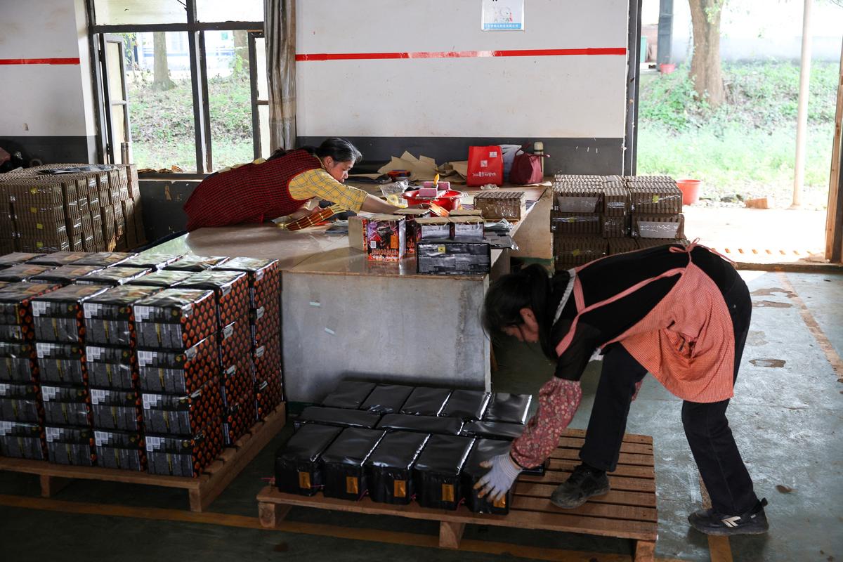 Employees work at Chili Fireworks factory in Liling, Hunan province, China, April 9, 2026.  REUTERS/Go Nakamura