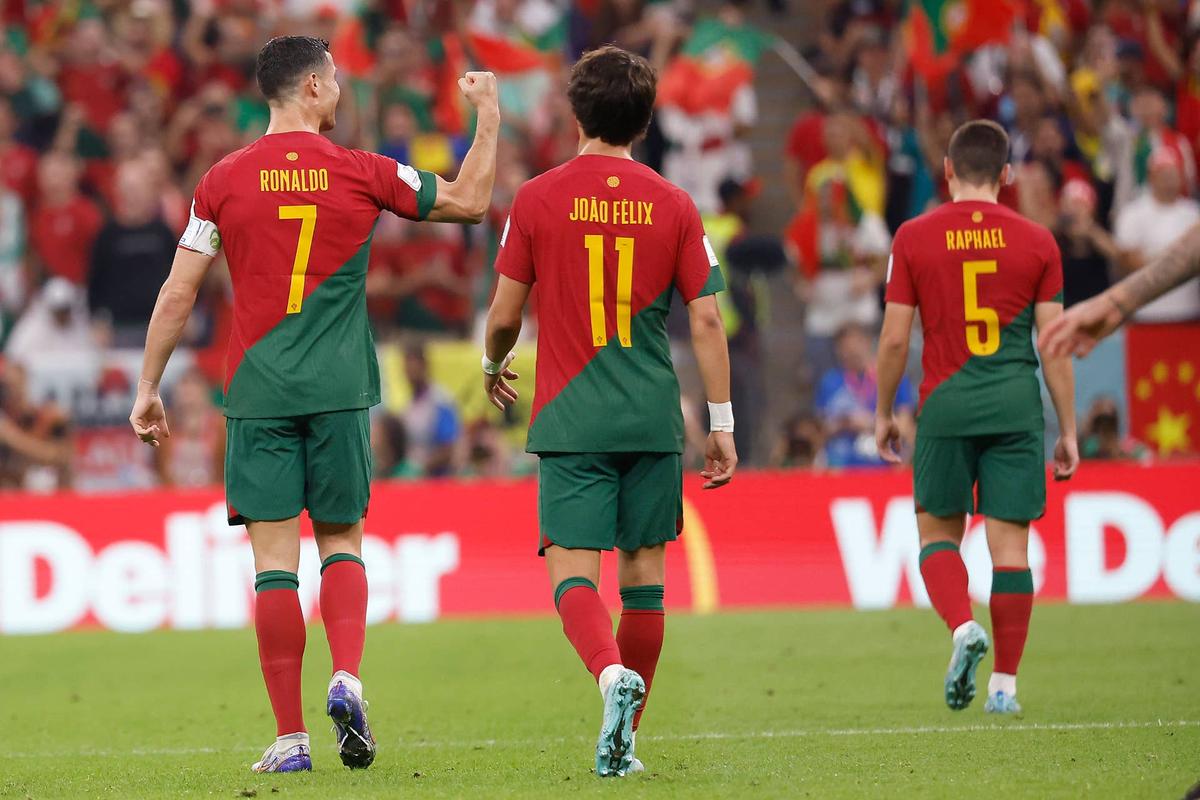  Portugal forward Cristiano Ronaldo (7) celebrates his goal scored against Uruguay with forward Joao Felix (11) during the second half of the group stage match in the 2022 World Cup. Yukihito Taguchi-USA TODAY Sports