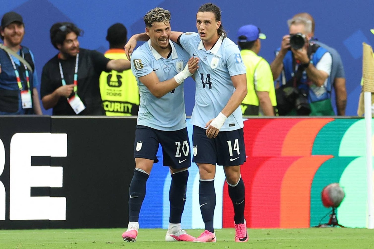 Uruguay's forward #14 Agustin Canobbio celebrates with teammate midfielder #20 Maximiliano Araujo scoring his team's second goal during the 2026 World Cup Group H football match between Uruguay and Cape Verde at the Miami Stadium in Miami Gardens on June 21, 2026. (Photo by PATRICIA DE MELO MOREIRA / AFP via Getty Images) Photo by PATRICIA DE MELO MOREIRA / AFP via Getty Images