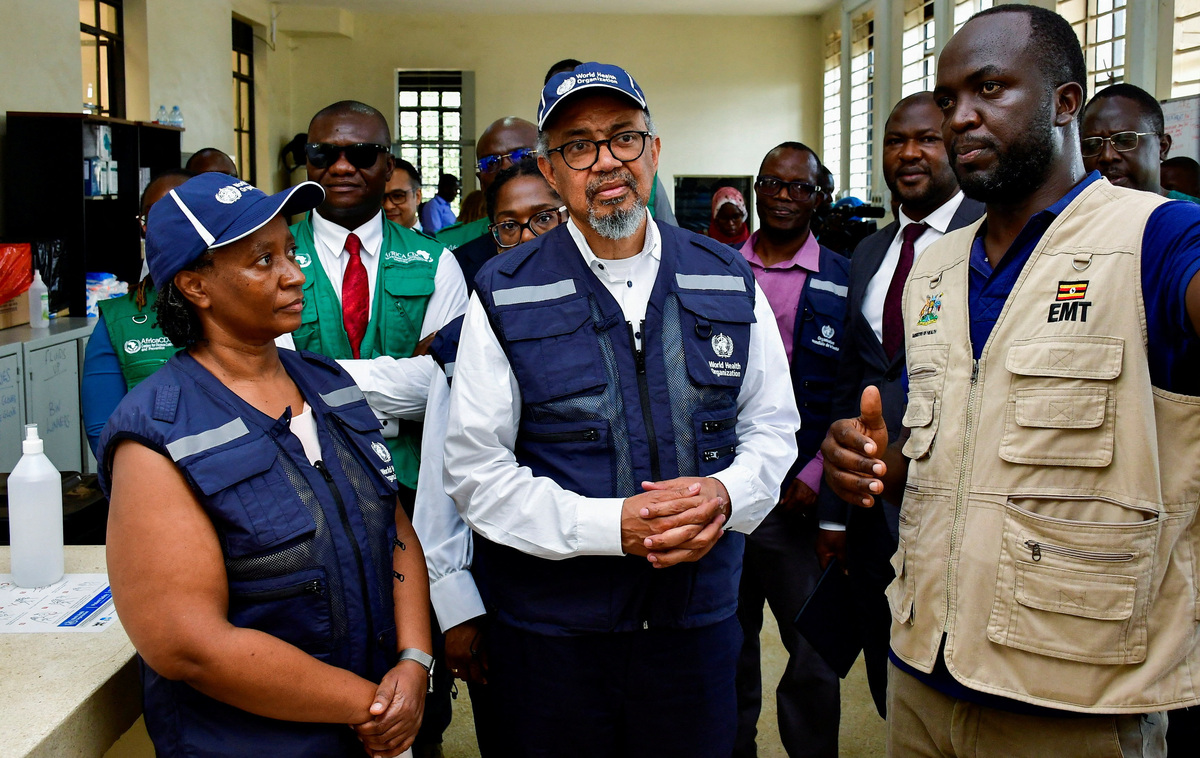 Director-General of the World Health Organisation (WHO) Tedros Adhanom Ghebreyesus, talks to Ugandan medical workers during his visit at the Mulago National Referral Hospital Isolation Unit, as aid agencies intensify efforts to contain a new Ebola outbreak involving the Bundibugyo Virus, in Mulago suburb, of Kampala, Uganda June 8, 2026. REUTERS/ Abubaker Lubowa