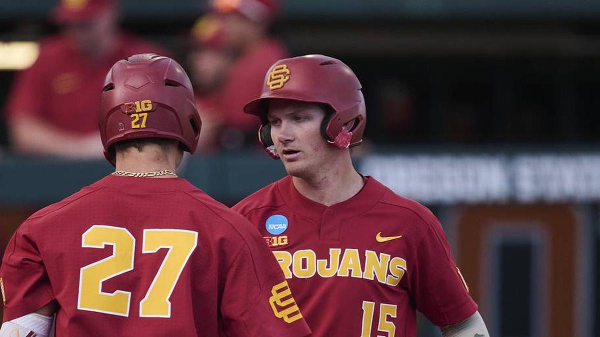  May 31, 2025; Corvallis, OR, USA; USC infielder Ethan Hedges (15) encourage infielder Bryce Martin-Grudzielanek (27) during the fifth inning after hitting his second home run of the game at the NCAA Corvallis Regional at Goss Stadium. Mandatory Credit: Troy Wayrynen-Imagn Images | Troy Wayrynen-Imagn Images 