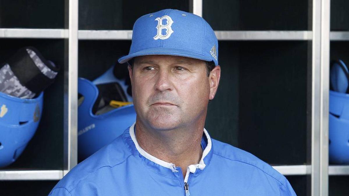  Jun 24, 2013; Omaha, NE, USA; UCLA Bruins head coach John Savage (22) looks on in the dugout before game 1 of the College World Series finals against the Mississippi State Bulldogs at TD Ameritrade Park. Mandatory Credit: Bruce Thorson-Imagn Images | Bruce Thorson-Imagn Images 