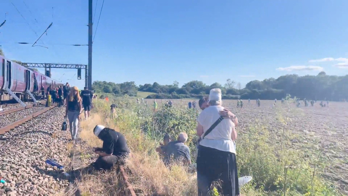 Emergency service workers gather at the scene of a collision involving two trains near Bedford, Britain, June 19, 2026, in this screengrab obtained from a video. Dr Pete Knapp/via REUTERS