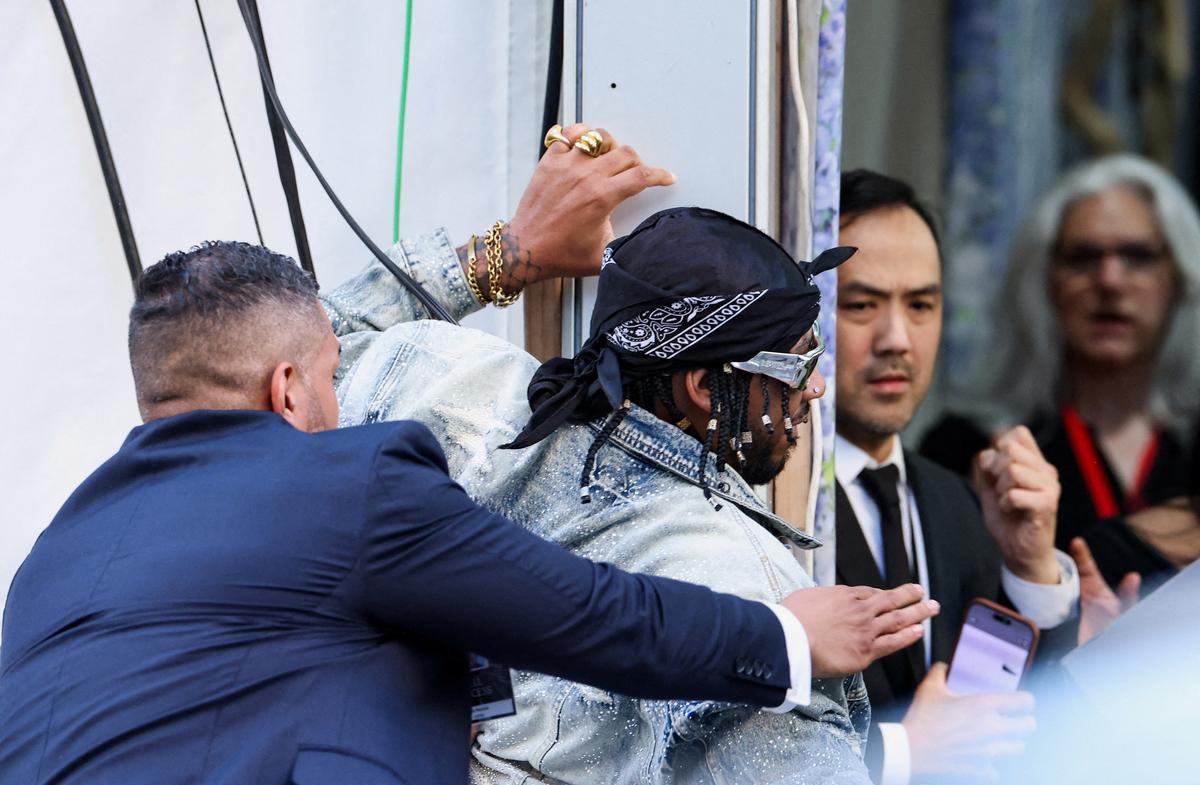Chris Smalls is detained after trying to enter the venue with a protest sign during the Met Gala, an annual fundraising gala held for the benefit of the Metropolitan Museum of Art's Costume Institute with this year's theme 'Costume Art' in New York City, New York, U.S., May 4, 2026. REUTERS/Brendan Mcdermid.