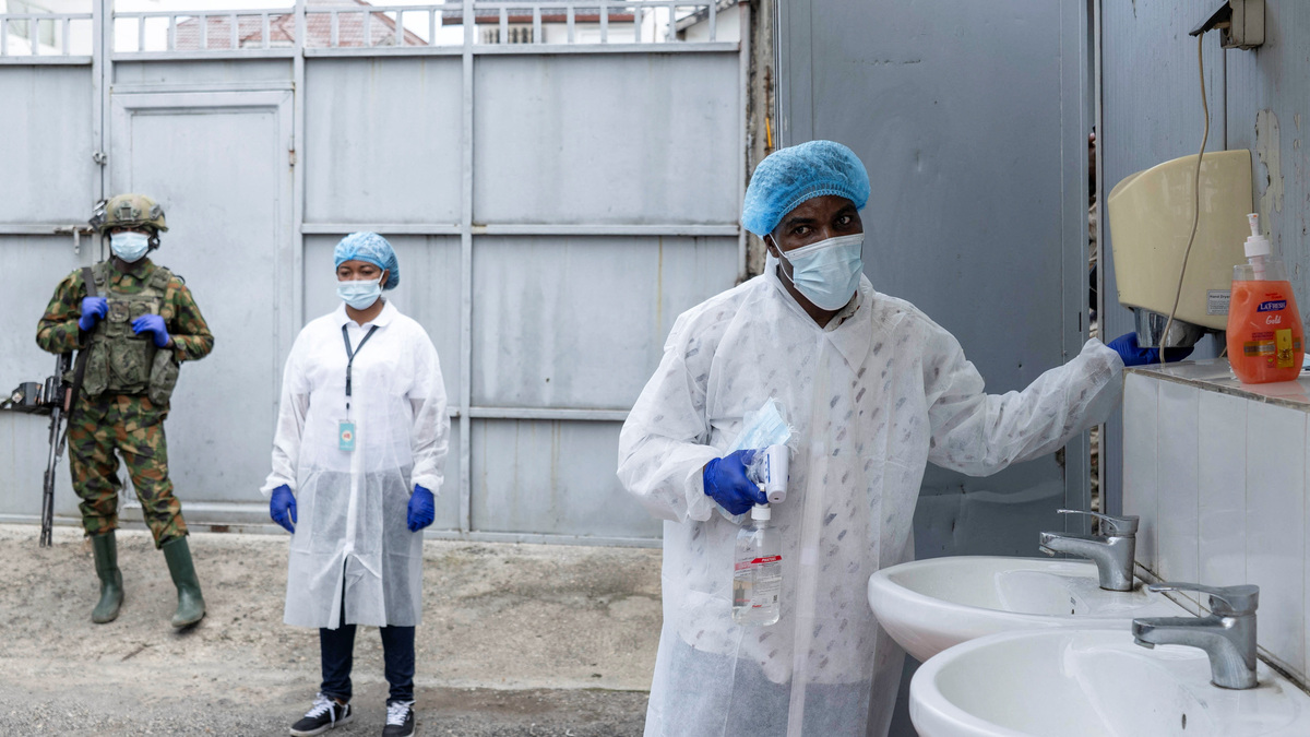 A Congolese health worker arranges a hand-washing station at the entrance to the Rodolphe Mérieux Laboratory, National Biomedical Research Institute (INRB), where samples from suspected Ebola cases are tested, as part of the response to the epidemic in Goma, North Kivu province of the Democratic Republic of Congo, May 19, 2026. REUTERS/Arlette Bashizi