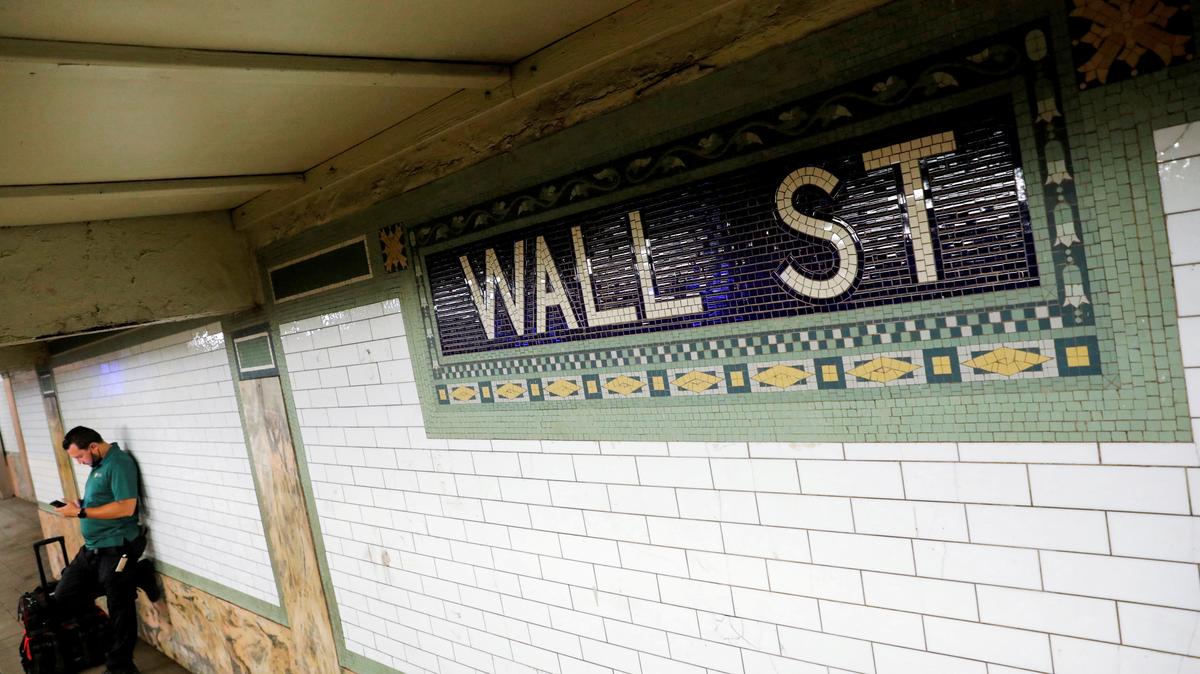 FILE PHOTO: A person waits on the Wall Street subway platform in the Financial District of Manhattan, New York City, U.S., August 20, 2021. REUTERS/Andrew Kelly/File Photo