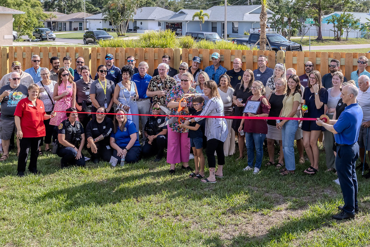 Family Promise staff, families, board members and other community members during a recent ribbon cutting ceremony at The Promise House.