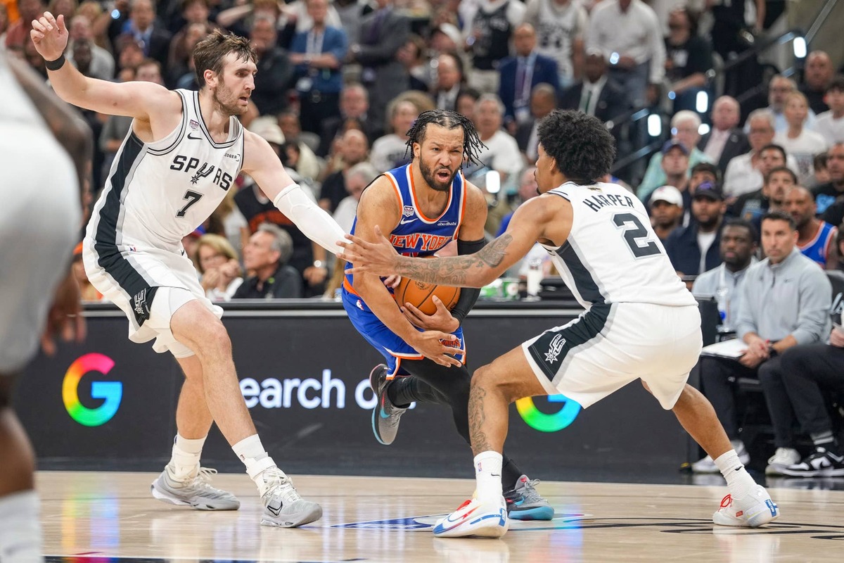  Jun 5, 2026; San Antonio, Texas, USA; New York Knicks guard Jalen Brunson (11) moves to the basket past San Antonio Spurs center Luke Kornet (7) and guard Dylan Harper (2) in the second quarter during game two of the 2026 NBA Finals at Frost Bank Center. Mandatory Credit: Scott Wachter-Imagn Images 