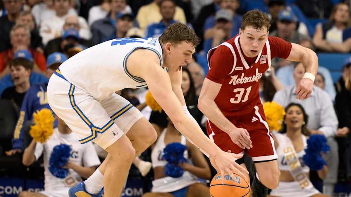 Mar 3, 2026; Los Angeles, California, USA; UCLA Bruins forward Tyler Bilodeau (34) and Nebraska Cornhuskers guard Cale Jacobsen (31) chase a loose bak during the second half at Pauley Pavilion presented by Wescom Financial. Mandatory Credit: Robert Hanashiro-Imagn Images | Robert Hanashiro-Imagn Images 