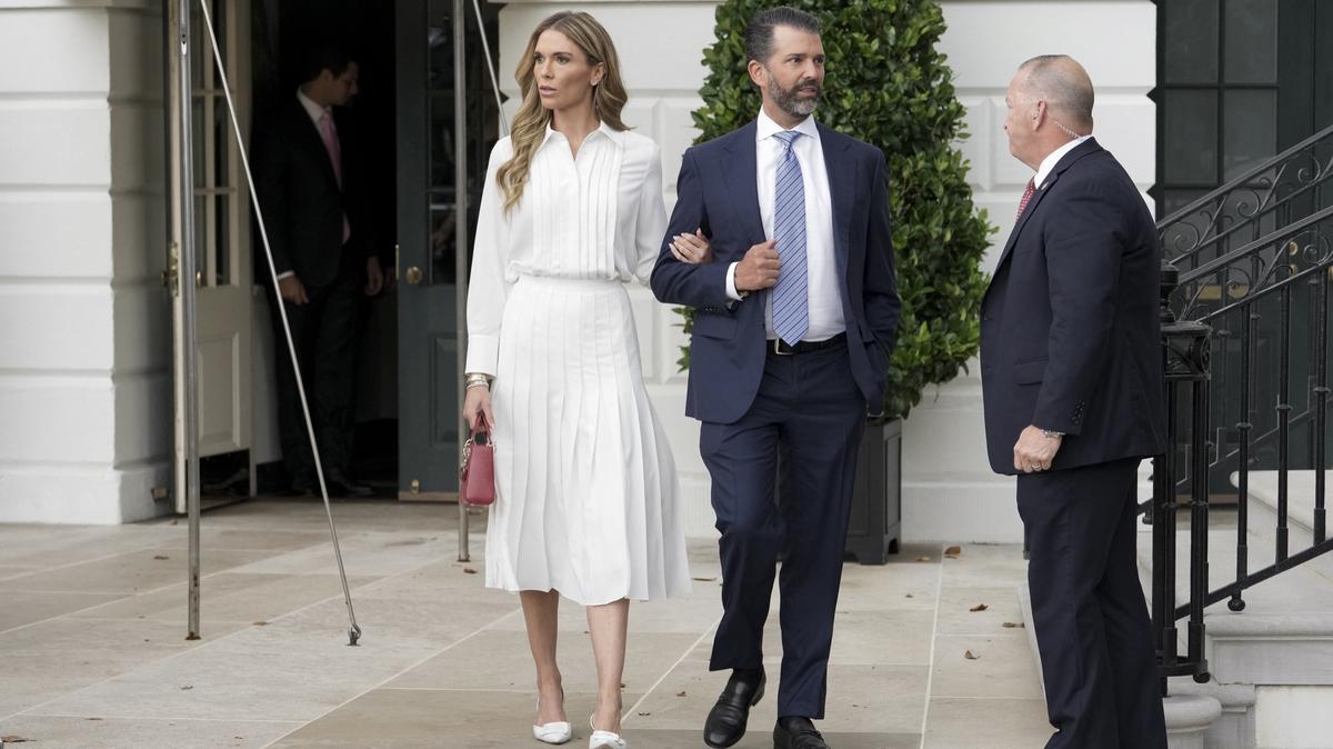 Donald Trump Jr. (R), son of the US president, and Bettina Anderson depart the White House to attend the Military Parade marking the 250th anniversary of the founding of the US Army, in Washington, DC, on June 14, 2025. (Photo by Oliver Contreras / AFP)