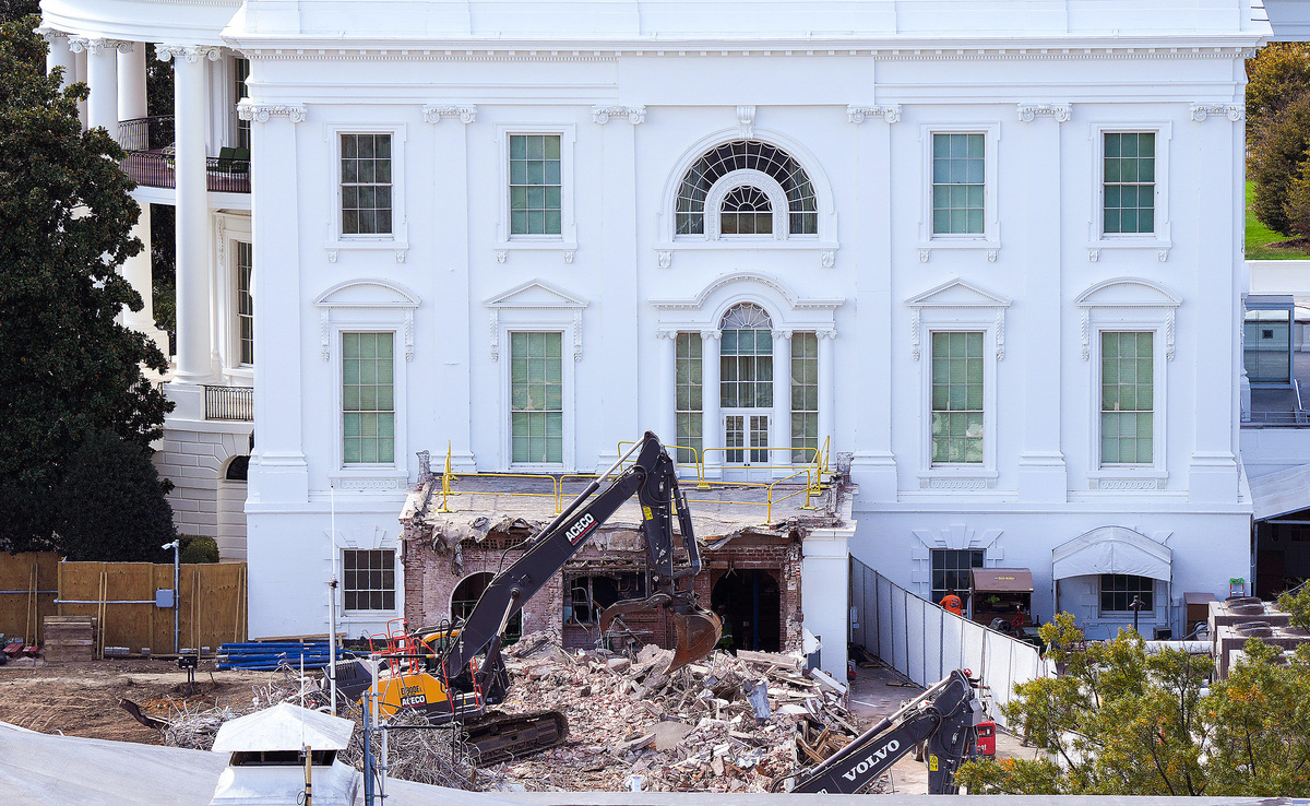  An excavator works to clear rubble after the East Wing of the White House was demolished on October 23, 2025. 