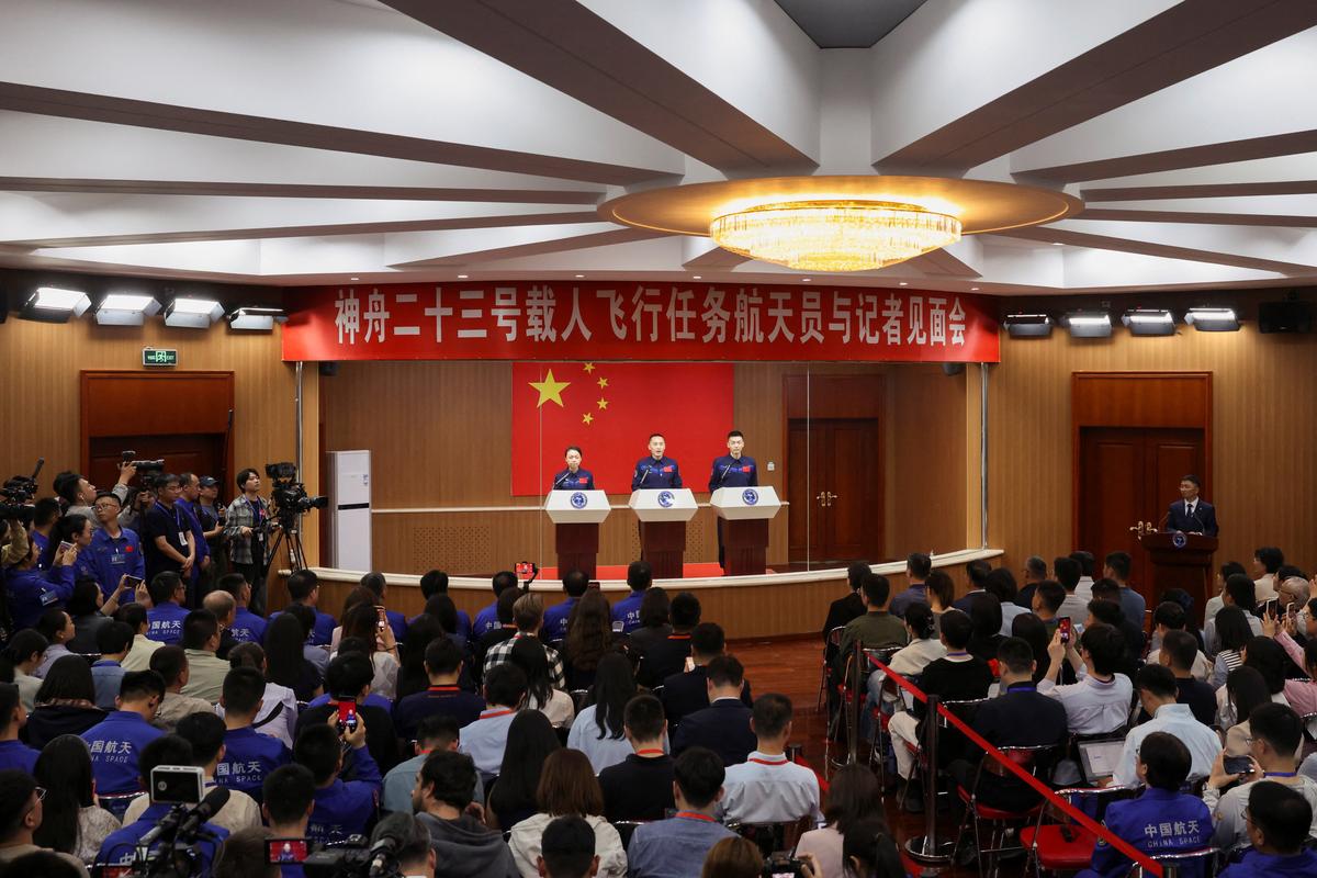 Astronauts Zhu Yangzhu, Zhang Zhiyuan, and Lai Ka-ying, who is the first astronaut from Hong Kong, attend a press conference before the Shenzhou-23 spaceflight mission to China's Tiangong space station, at Jiuquan Satellite Launch Center, near Jiuquan, Gansu province, China, May 23, 2026. REUTERS/Maxim Shemetov