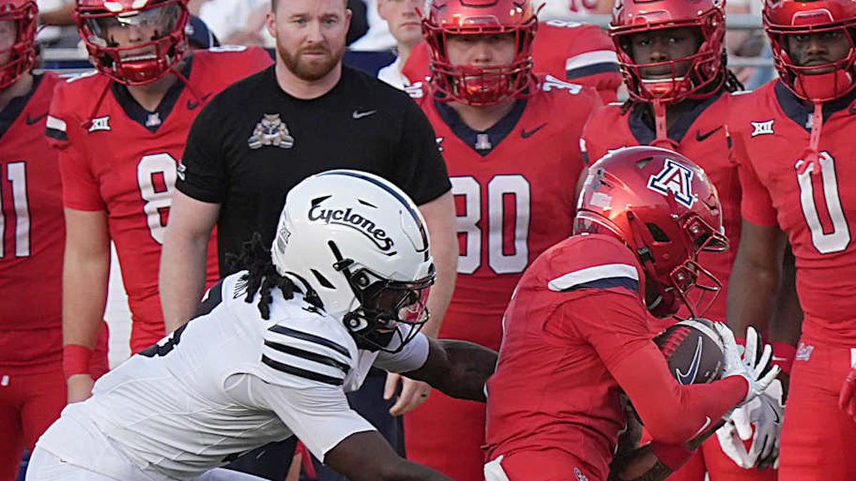  Arizona Wildcats wide receiver Kris Hutson (4) gets tackle by Iowa State Cyclones' defensive back Jontez Williams (3) after making a catch during the first quarter in the Big-12 conference showdown on Sept. 27, 2025, at Jack Trice Stadium in Ames, Iowa. | Nirmalendu Majumdar/Ames Tribune / USA TODAY NETWORK via Imagn Images 