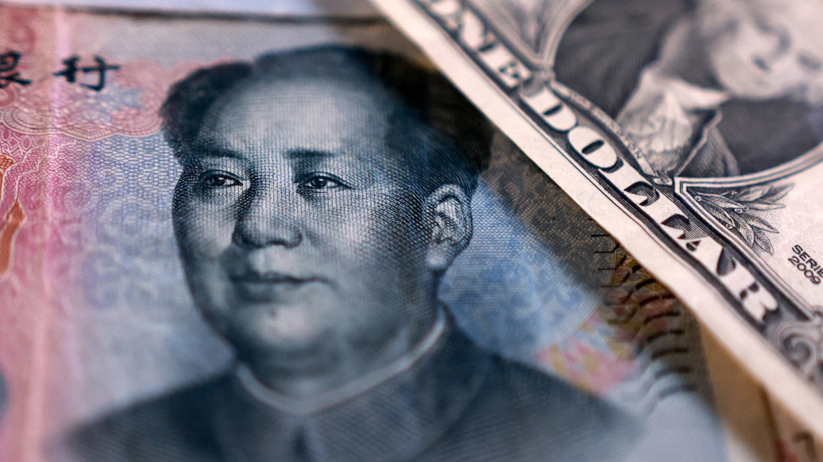 U.S. dollar and Chinese Yuan banknotes are seen in this illustration taken September 12, 2025. REUTERS/Dado Ruvic/Illustration