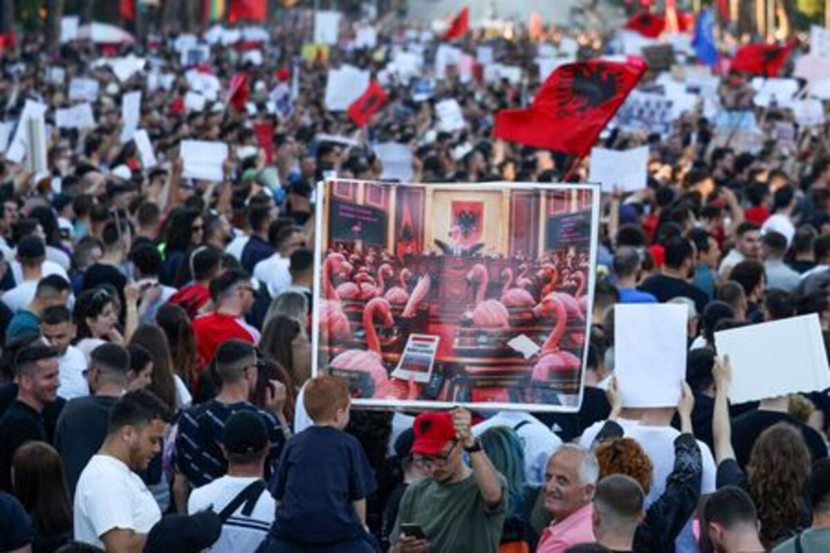 Protesters hold banners during a protest against a luxury resort development planned by a company linked with Donald Trump's son-in-law, Jared Kushner, on an environmentally sensitive part of the Adriatic coast, in Tirana, Albania, June 4, 2026. REUTERS/Florion Goga