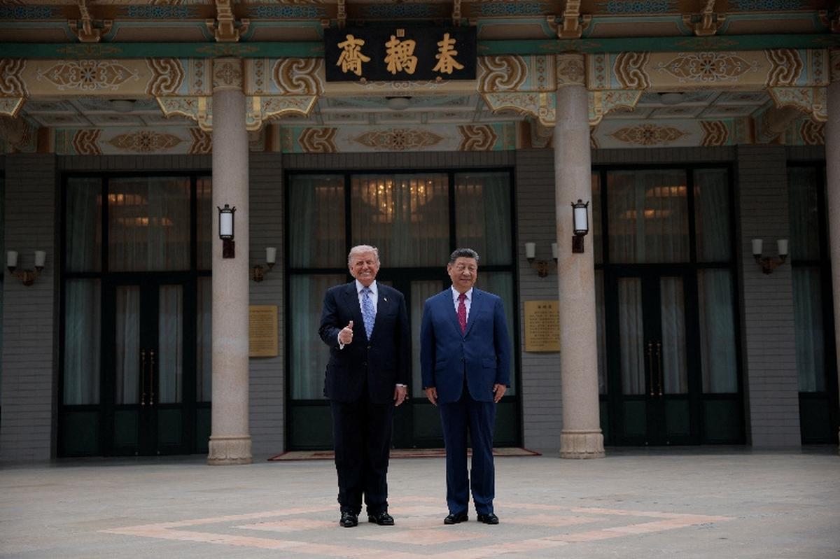 U.S. President Donald Trump poses for a picture with Chinese President Xi Jinping during a visit to the  Zhongnanhai Garden in Beijing, China, May 15, 2026. REUTERS/Evan Vucci/Pool