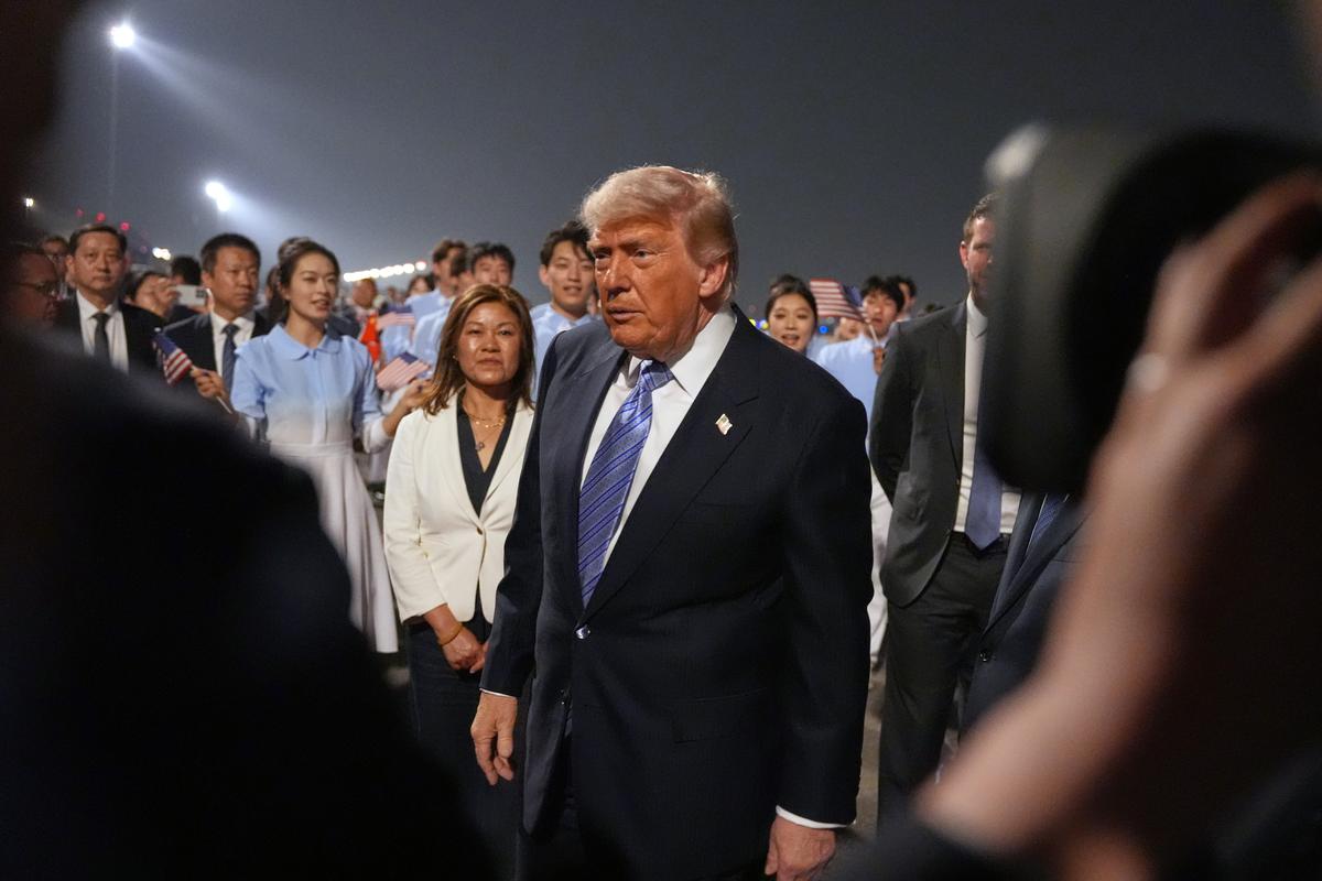  President Donald Trump walks during a welcome ceremony as he arrives on Air Force One on May 13, 2026, at Beijing Capital International Airport in China. 