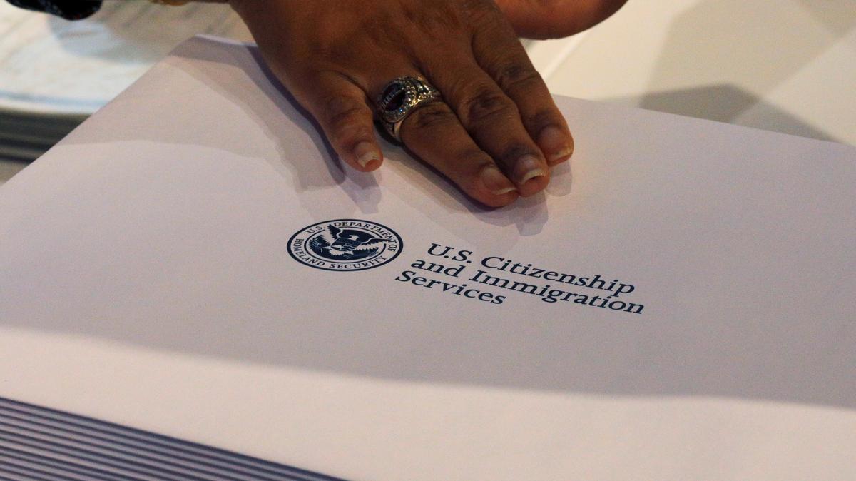 Information packs are distributed by the U.S. Citizenship and Immigration Services following a citizenship ceremony at the John F. Kennedy Presidential Library in Boston, Massachusetts, U.S., July 18, 2018.   REUTERS/Brian Snyder/File Photo