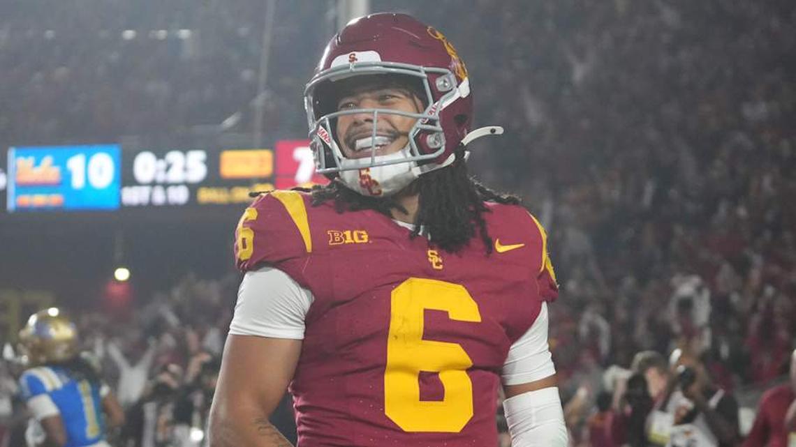  Nov 29, 2025; Los Angeles, California, USA; Southern California Trojans wide receiver Makai Lemon (6) celebrates after catching a 32-yard touchdown pass against the UCLA Bruins in the second half at United Airlines Field at Los Angeles Memorial Coliseum. Mandatory Credit: Kirby Lee-Imagn Images | Kirby Lee-Imagn Images 
