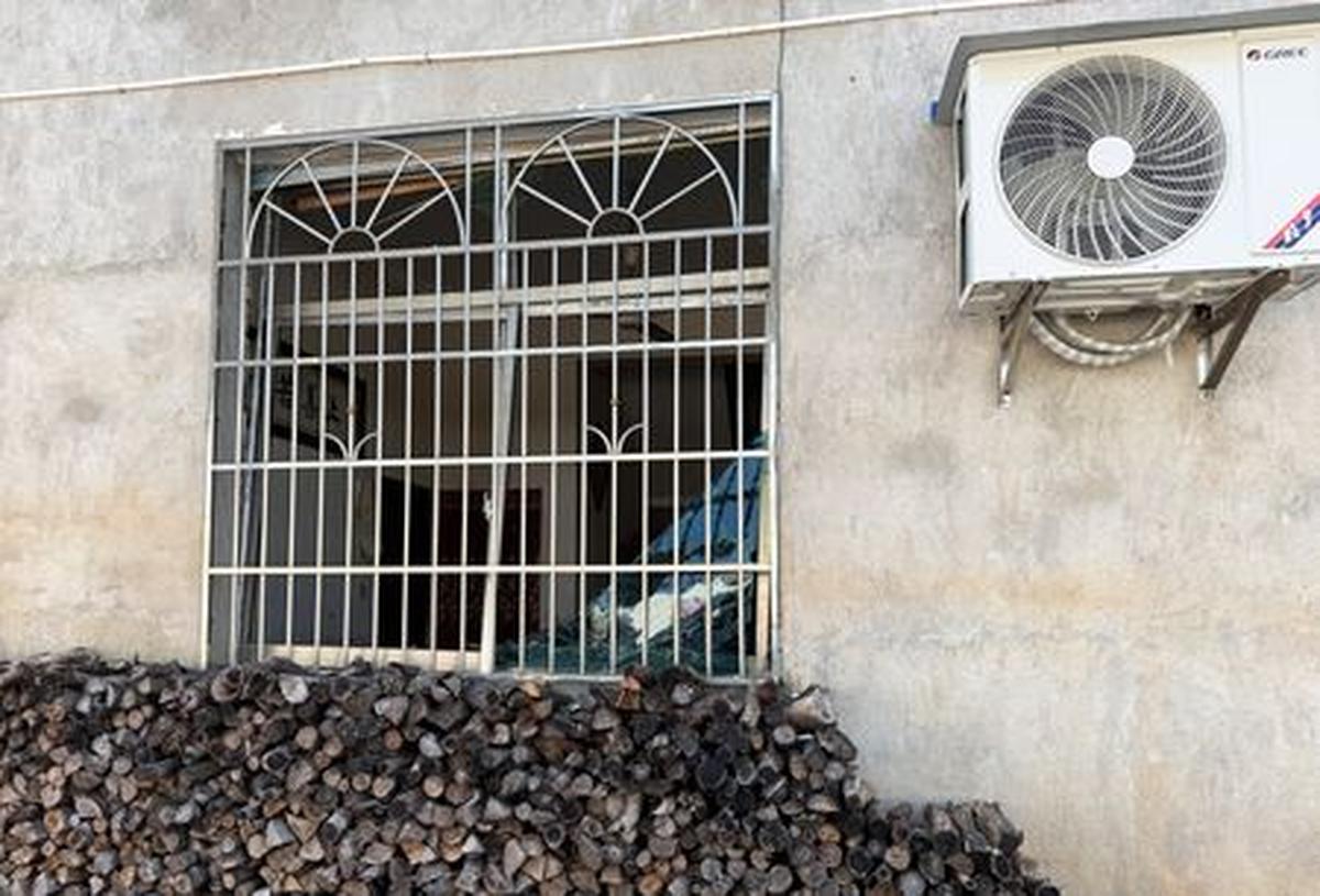 A damaged window of a building after a blast at a fireworks manufacturing factory in Liuyang, Hunan province, China, May 6, 2026. REUTERS/Maxim Shemetov