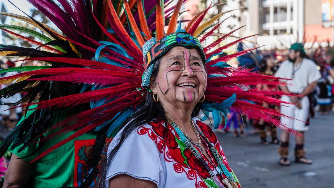 An Aztec dancer during Chicano Park Day in Barrio Logan on April 19, 2025. (Ariana Drehsler / For The San Diego Union-Tribune)