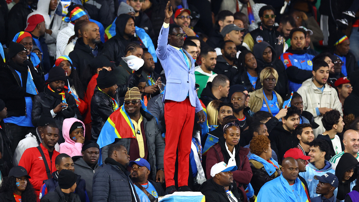 Soccer Football - CAF Africa Cup of Nations - Morocco 2025 - Round of 16 - Algeria v Democratic Republic of Congo - Moulay El Hassan Stadium, Rabat, Morocco - January 6, 2026 Democratic Republic of Congo fan Michel Nkuka Mboladinga poses as a statue of the country's independence hero Patrice Lumumba during the match REUTERS/Siphiwe Sibeko/File Photo