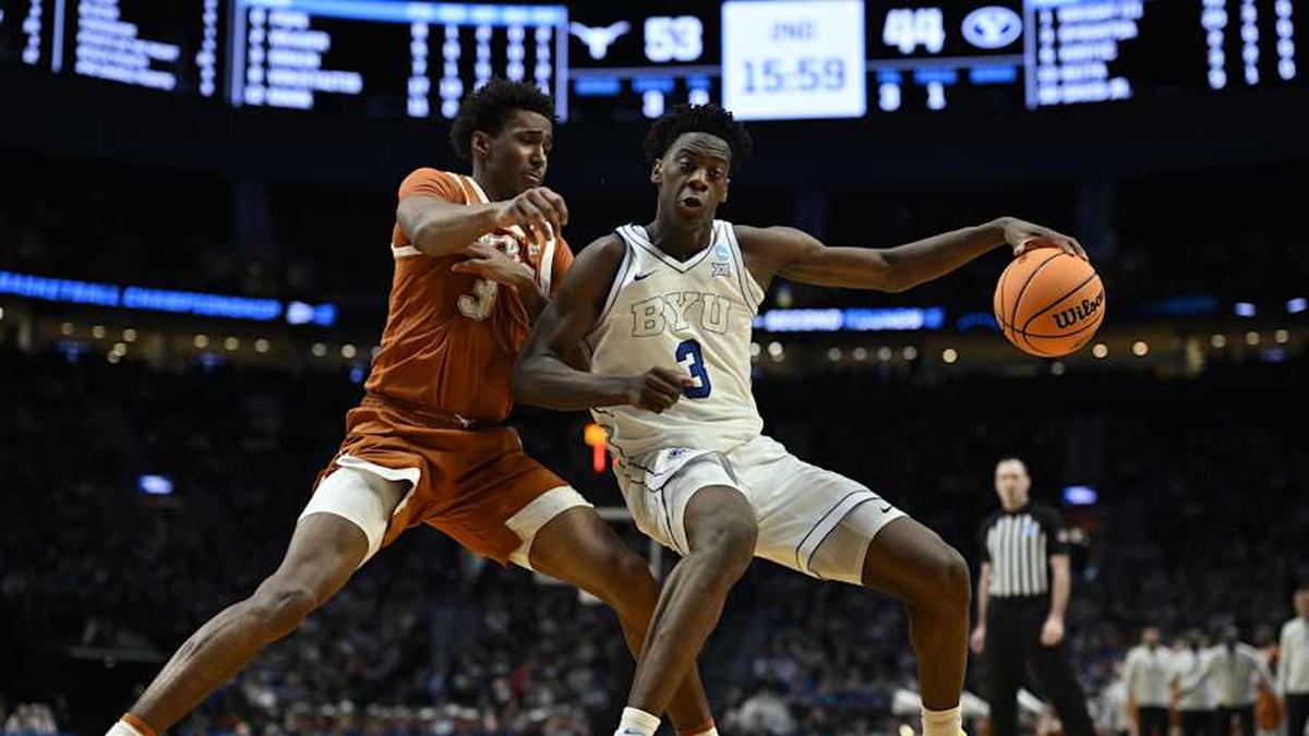  Mar 19, 2026; Portland, OR, USA; BYU Cougars forward AJ Dybantsa (3) dribbles against Texas Longhorns forward Dailyn Swain (3) in the second half during a first round game of the men's 2026 NCAA Tournament at Moda Center. Mandatory Credit: Troy Wayrynen-Imagn Images | Troy Wayrynen-Imagn Images 