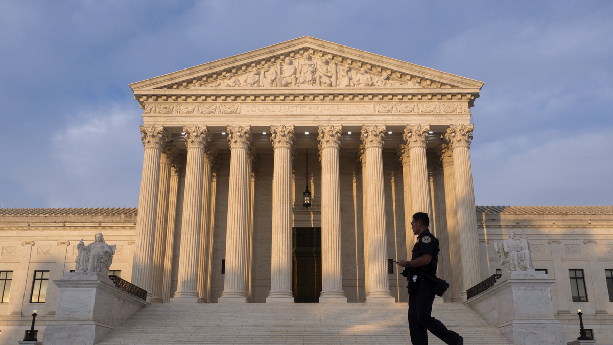 U.S. Supreme Court Exterior. A U.S. Supreme Court police  officer walks in front of the U.S. Supreme Court at sunset on June 6, 2026 in Washington, DC.