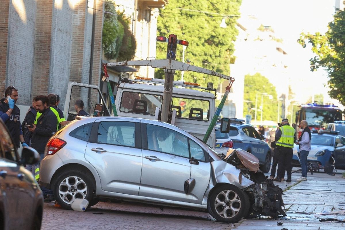 The car that drove into pedestrians is removed from the scene after several people were injured in the center of the northern Italian city of Modena, Italy, May 16, 2026. REUTERS/Stringer