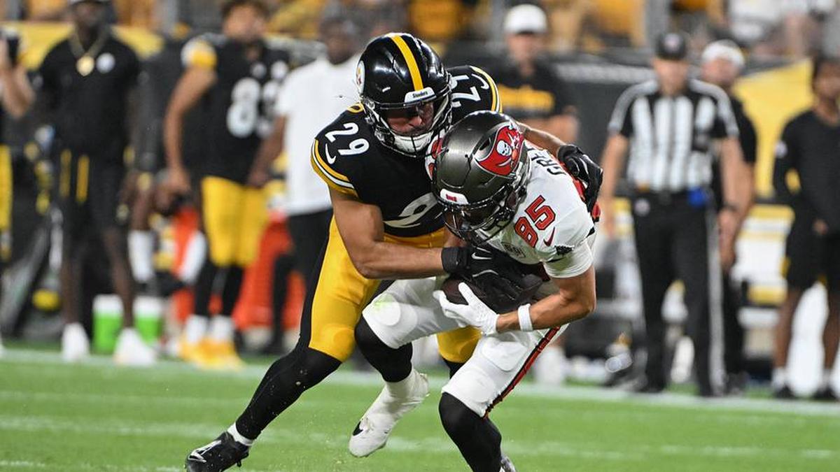  Aug 16, 2025; Pittsburgh, Pennsylvania, USA; Pittsburgh Steelers safety Sebastian Castro (29) tackles Tampa Bay Buccaneers wide receiver Garrett Greene (85) during the second half at Acrisure Stadium. Mandatory Credit: Barry Reeger-Imagn Images | Barry Reeger-Imagn Images 