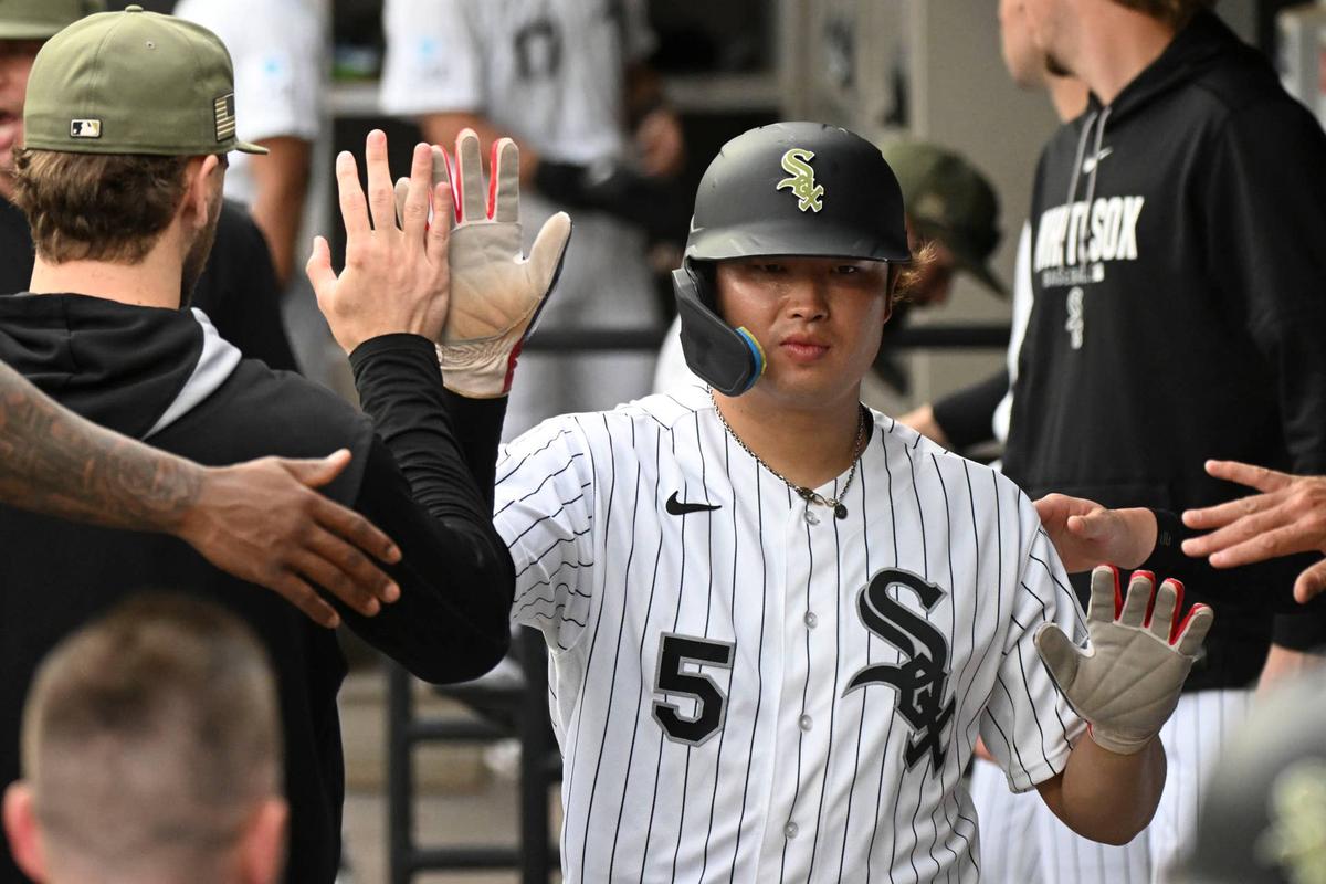  May 16, 2026; Chicago, Illinois, USA; Chicago White Sox first baseman Munetaka Murakami (5) celebrates in the dugout after scoring during the first inning against the Chicago Cubs at Rate Field. Mandatory Credit: Matt Marton-Imagn Images 