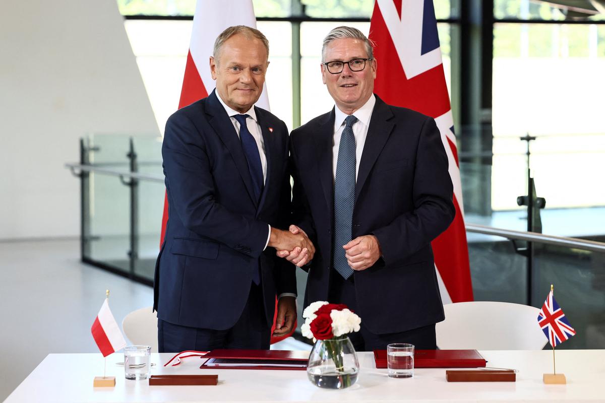 Britain's Prime Minister Keir Starmer and Poland's Prime Minister Donald Tusk attend a signing ceremony of a UK-Poland defence and security treaty at the Battle of Britain Bunker in Uxbridge, Britain, May 27, 2026. REUTERS/Jack Taylor/Pool
