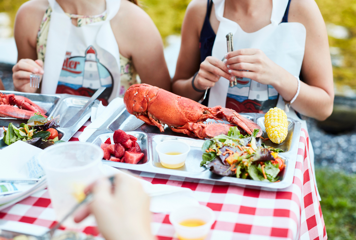  Kids eating lobster at Migis Lodge. 