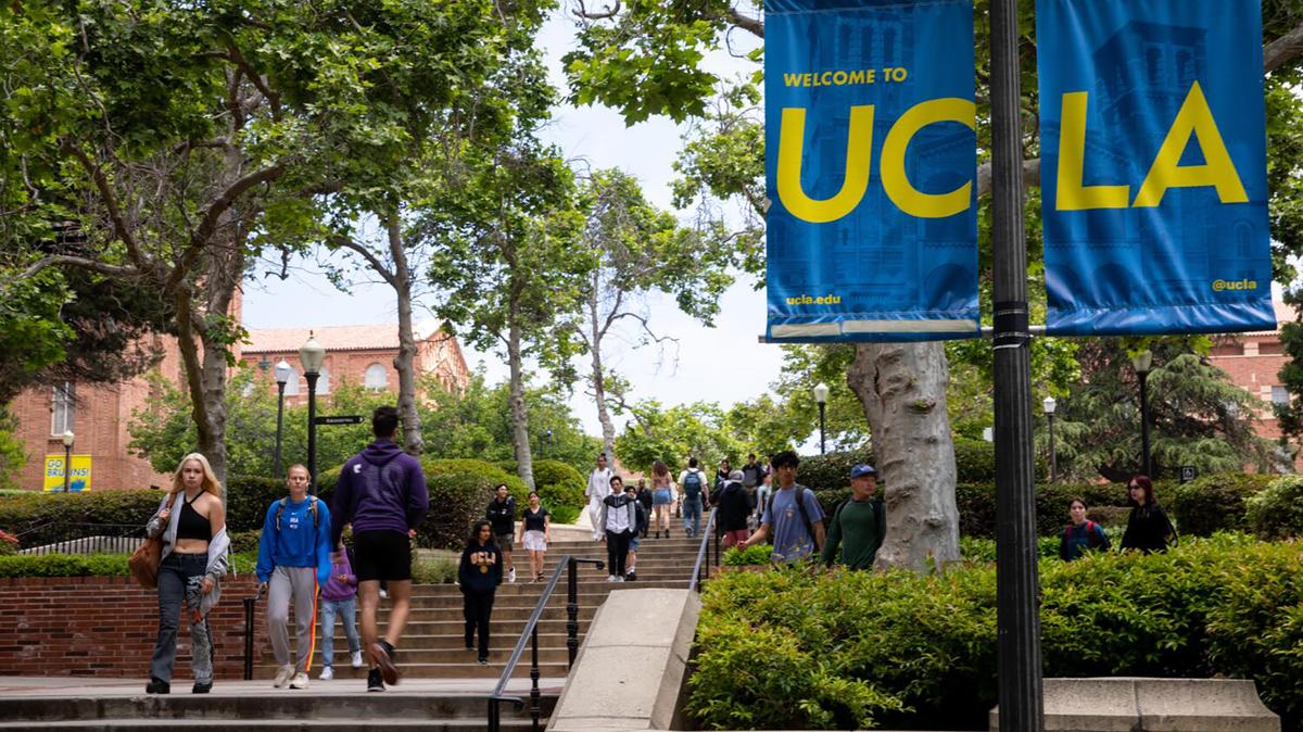 Signage and people along Bruin Walk East, on the UCLA campus in Los Angeles on May 17, 2023. (Jay L. Clendenin/Los Angeles Times/TNS)