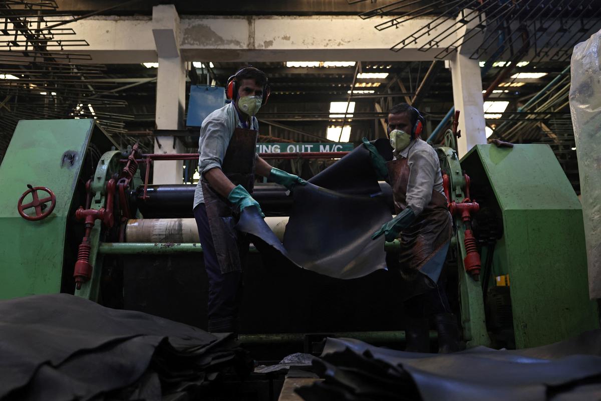 Workers hold a buffalo hide at a leather factory of Kings International Ltd. in Kanpur, India, May 13, 2026. REUTERS/Bhawika Chhabra