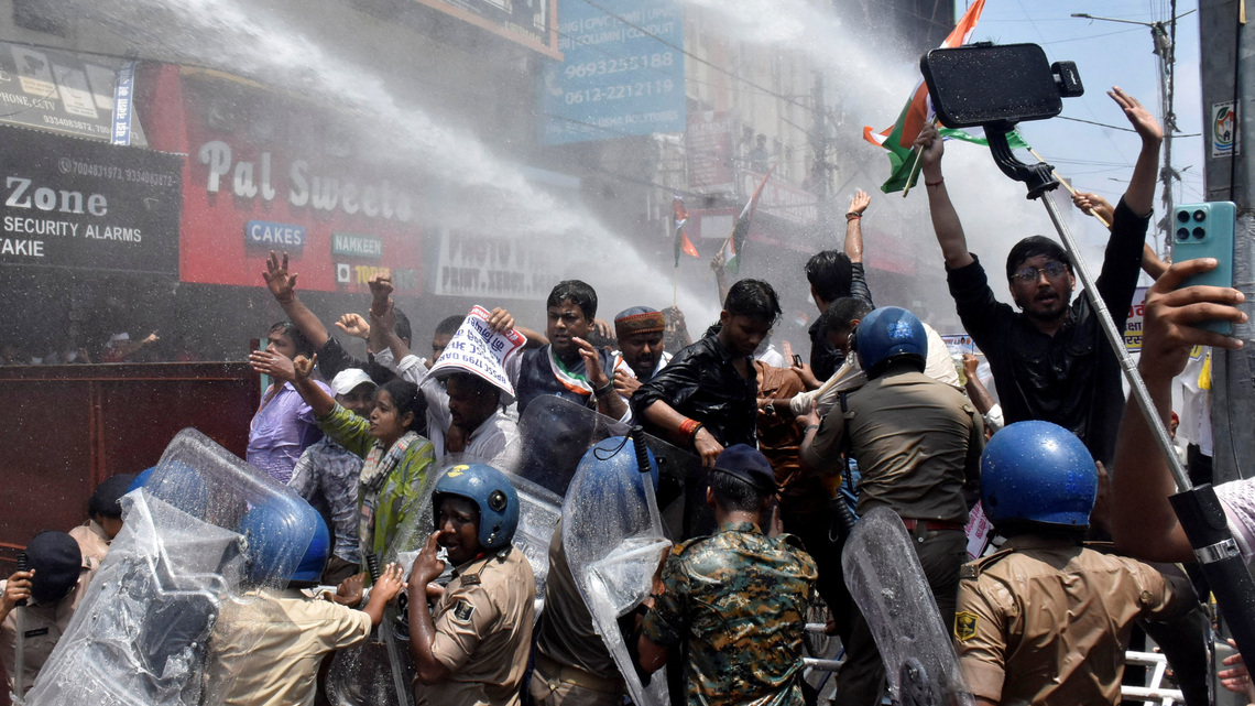 Indian police use water cannon at new protest over test paper leaks