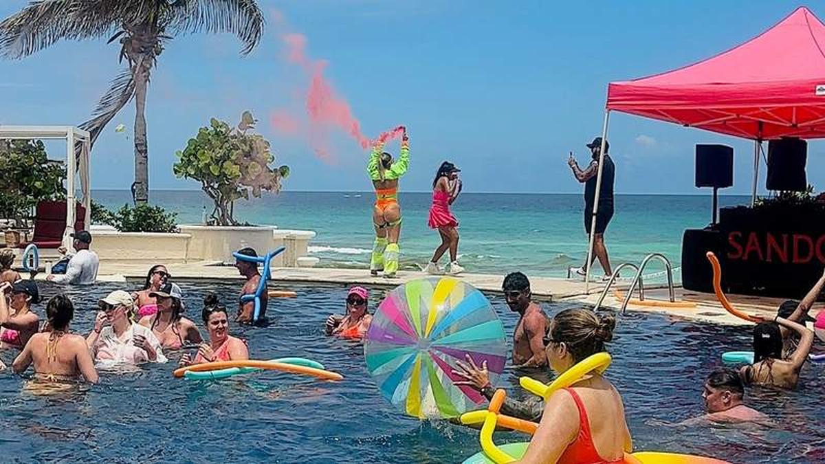 Guests dance and float in the main pool during one of the lively afternoon parties at Sandos Cancun. Photo credit: Shelly Peterson 