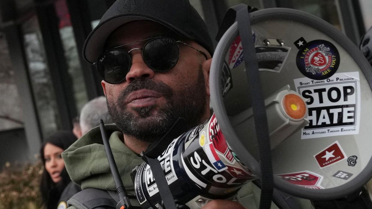Former national chairman of the Proud Boys, Enrique Tarrio, holds a megaphone following a march from The Ellipse to the U.S. Capitol in memory of those who died on, or in the aftermath, of the January 6, 2021 attack on the U.S. Capitol, on the fifth anniversary of the attack in Washington, D.C., U.S., January 6, 2026. REUTERS/Leah Millis
