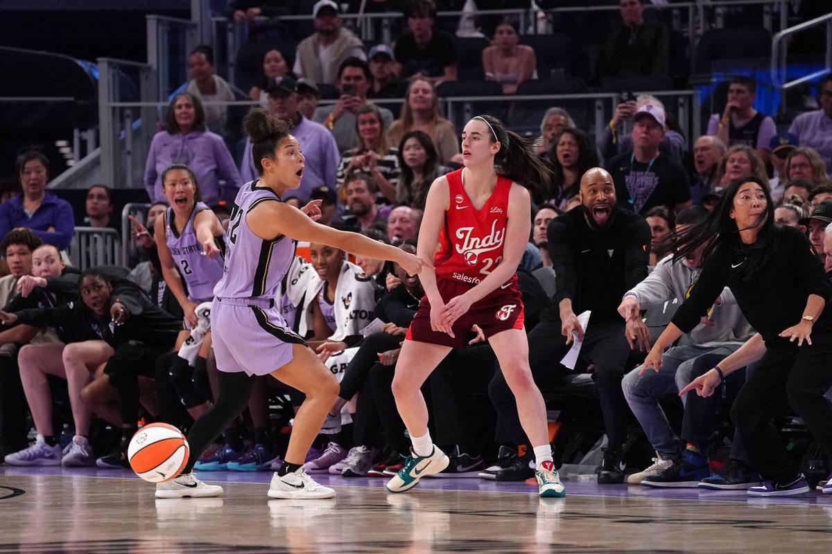  May 28, 2026; San Francisco, California, USA; Golden State Valkyries guard Veronica Burton (22) shows that Indiana Fever guard Caitlin Clark (22) had a foot out of bounds in the final minutes of the fourth quarter at Chase Center. Mandatory Credit: David Gonzales-Imagn Images 