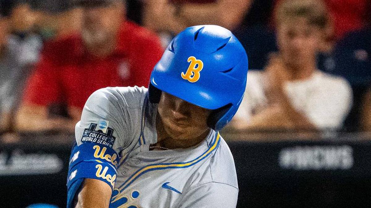  Jun 17, 2025; Omaha, Neb, USA; UCLA Bruins first baseman Mulivai Levu (39) hits a triple against the Arkansas Razorbacks during the ninth inning at Charles Schwab Field. Mandatory Credit: Dylan Widger-Imagn Images | Dylan Widger-Imagn Images 