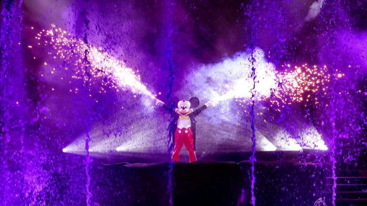 Mickey Mouse fires his fan-favorite hand sparklers during the first night of ‘Fantasmic’ returning to Disney’s Hollywood Studios, Thursday, Nov. 3, 2022, in Lake Buena Vista, Fla.