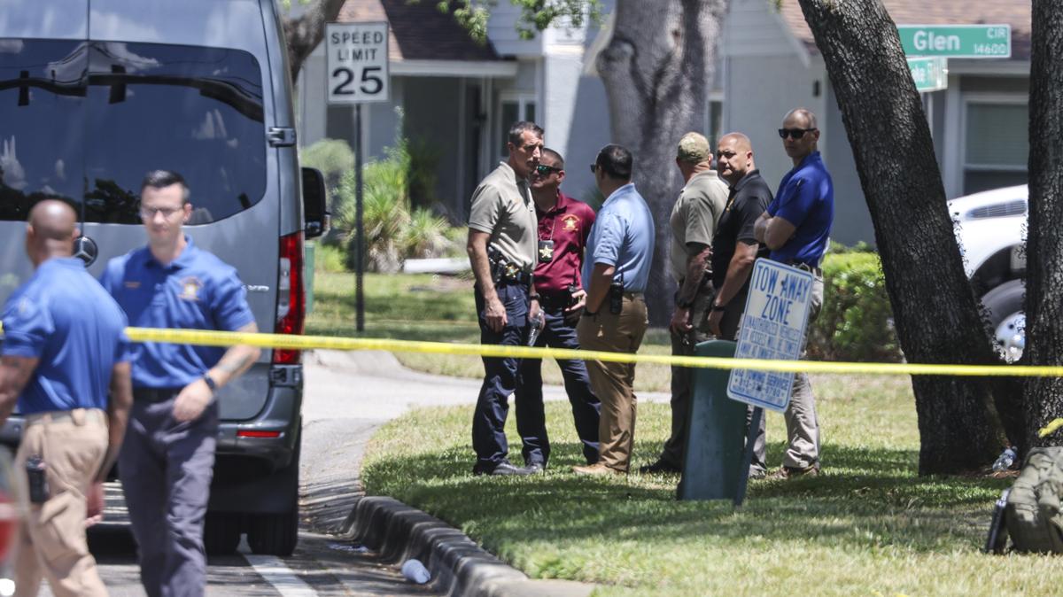 Hillsborough County Sheriff’s Office investigators are seen in North Tampa's Lake Forest subdivision Friday after a suspect in the case of two missing University of South Florida students was arrested there. (Douglas R. Clifford/Tampa Bay Times/TNS)