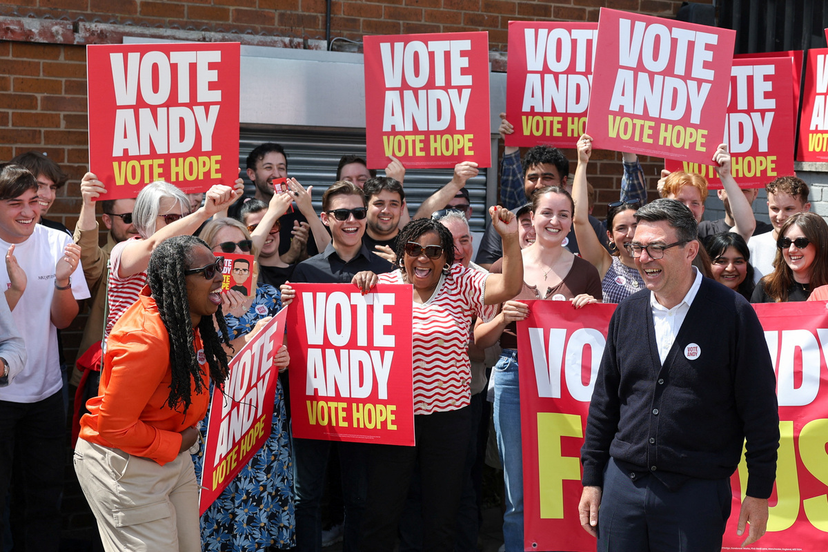 Greater Manchester mayor and Labour candidate Andy Burnham meets with supporters during the Makerfield by-election, triggered by the resignation of Labour MP John Simons, in Wigan, Britain, June 18, 2026. REUTERS/Temilade Adelaja