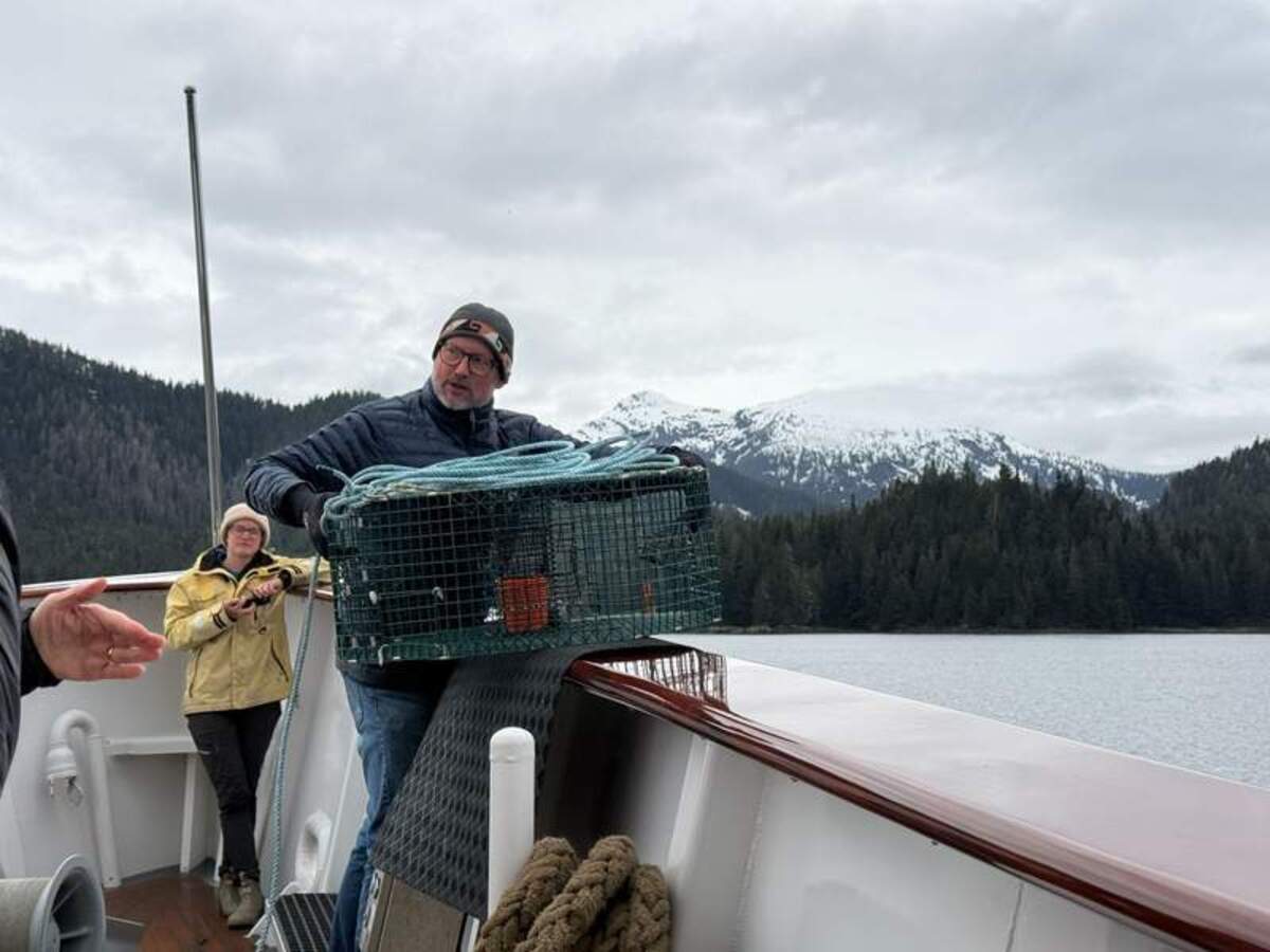  James Kirkland prepares to drop a shrimp pot into Kelp Bay. Photo credit: Mimi Slawoff 
