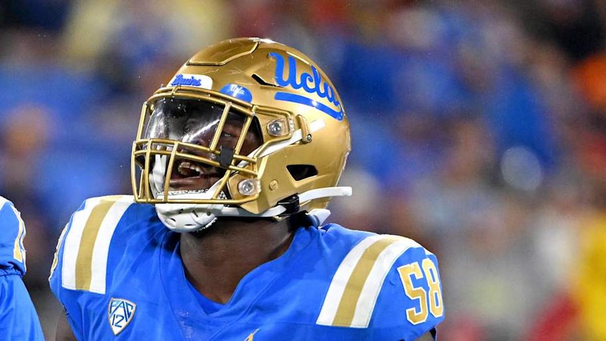  Oct 29, 2022; Pasadena, California, USA; UCLA Bruins linebacker Laiatu Latu (15) and defensive lineman Gary Smith III (58) celebrate after a sack of Stanford Cardinal quarterback Tanner McKee (18) in the first half at the Rose Bowl. Mandatory Credit: Jayne Kamin-Oncea-Imagn Images | Jayne Kamin-Oncea-Imagn Images 