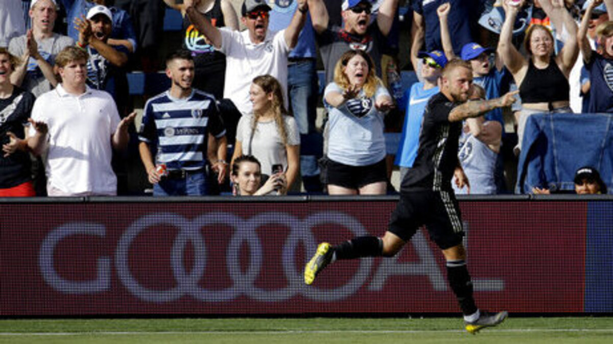 Sporting Kansas City forward Johnny Russell celebrates after scoring a goal during the first half of an MLS soccer match against the Seattle Sounders, on May 26, 2019, in Kansas City, Kan.