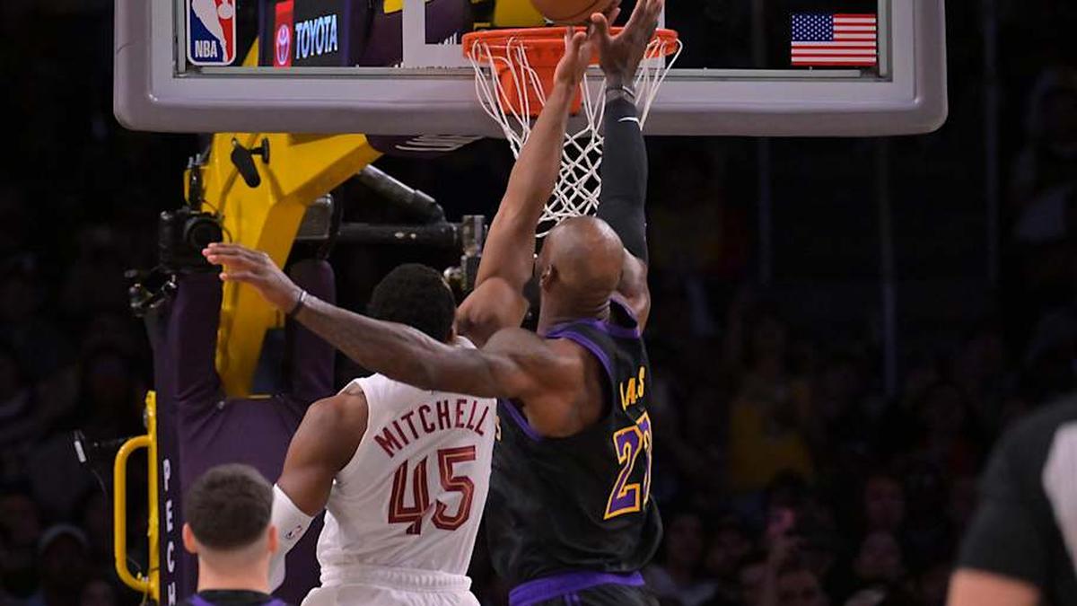  Mar 31, 2026; Los Angeles, California, USA; Los Angeles Lakers forward LeBron James (23) blocks a shot by Cleveland Cavaliers guard Donovan Mitchell (45) in the opening minutes of the game at Crypto.com Arena. | Jayne Kamin-Oncea-Imagn Images 