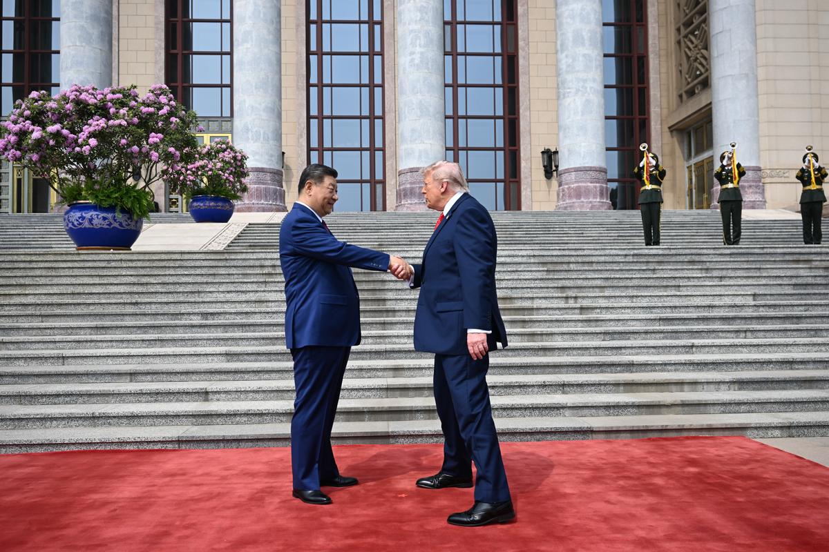President Xi Jinping of China greets President Donald Trump outside the Great Hall of the People in Beijing during their two-day summit, on Thursday, May 14, 2026. During the first U.S. presidential visit to China in nearly a decade, Xi delivered a warning on Taiwan, saying that the issue, if handled poorly, could lead to conflict and "an extremely dangerous situation." (Kenny Holston/The New York Times)..