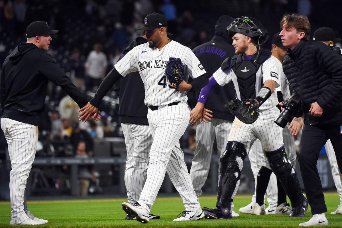  Apr 22, 2026; Denver, Colorado, USA; Colorado Rockies pitcher Antonio Senzatela (49) celebrates with teammates after a win against the San Diego Padres at Coors Field. Mandatory Credit: Christopher Hanewinckel-Imagn Images